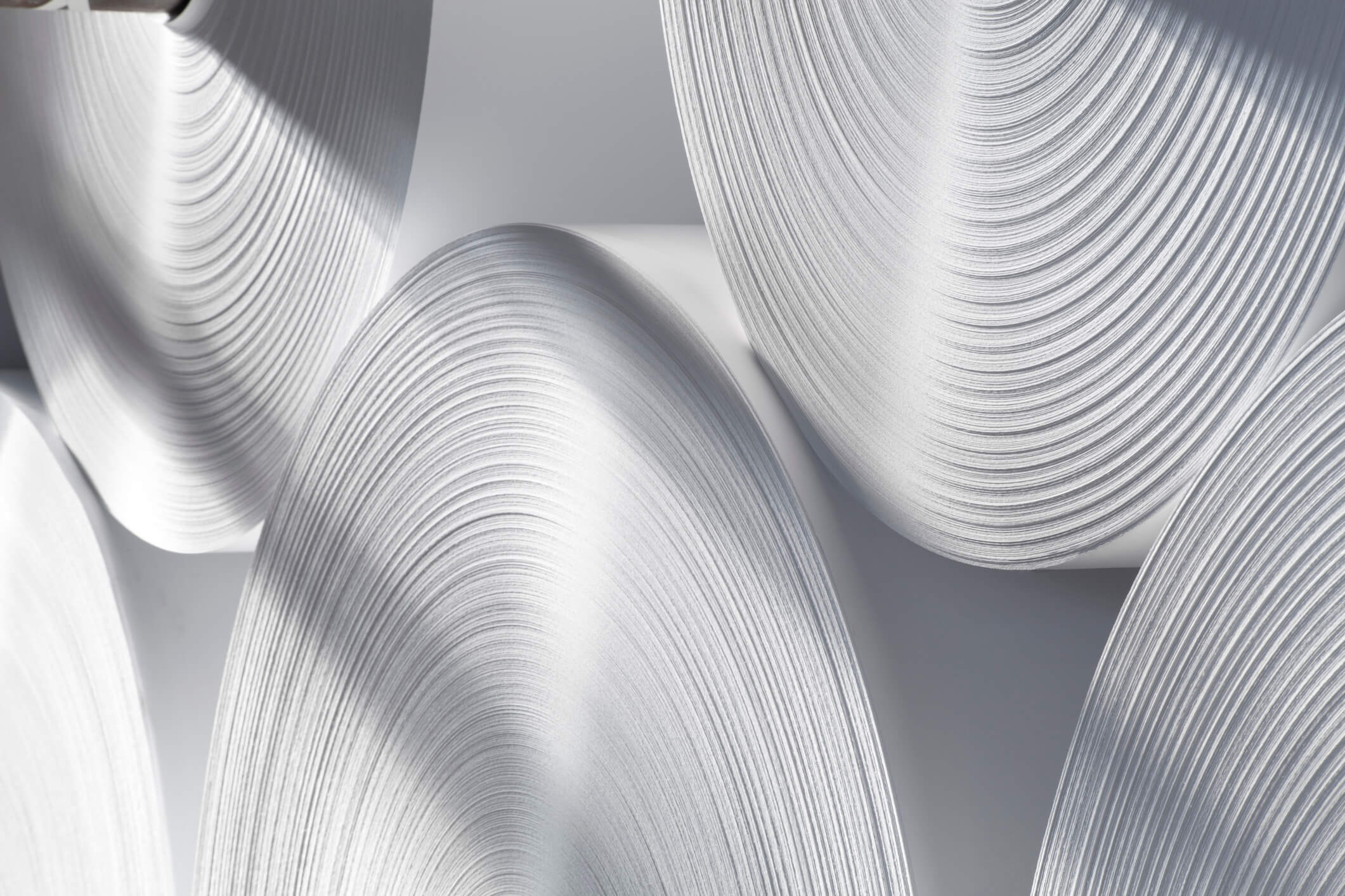 a bunch of rolls of paper are stacked on top of each other